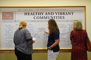 Town Hall participants publish their 'headlines' of what they think Ole Miss will accomplish in the near future on several boards in the ballroom. Photo by Robert Jordan/Ole Miss Communications