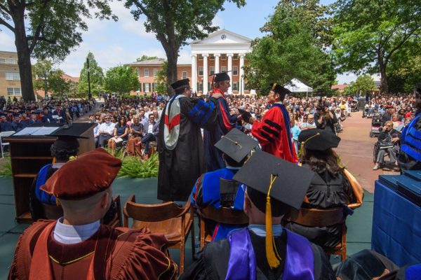 Graduates outside with Lyceum in background