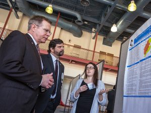 Vitter with Gladden and Researcher presenting charts