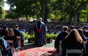 Chancellor Boyce addresses graduating class in the grove during commencement